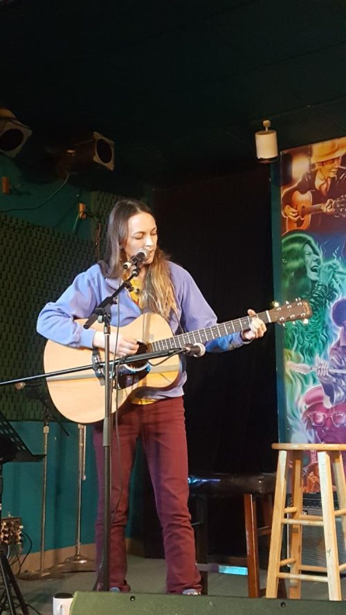 Heidi Feroe plays guitar at open mic night